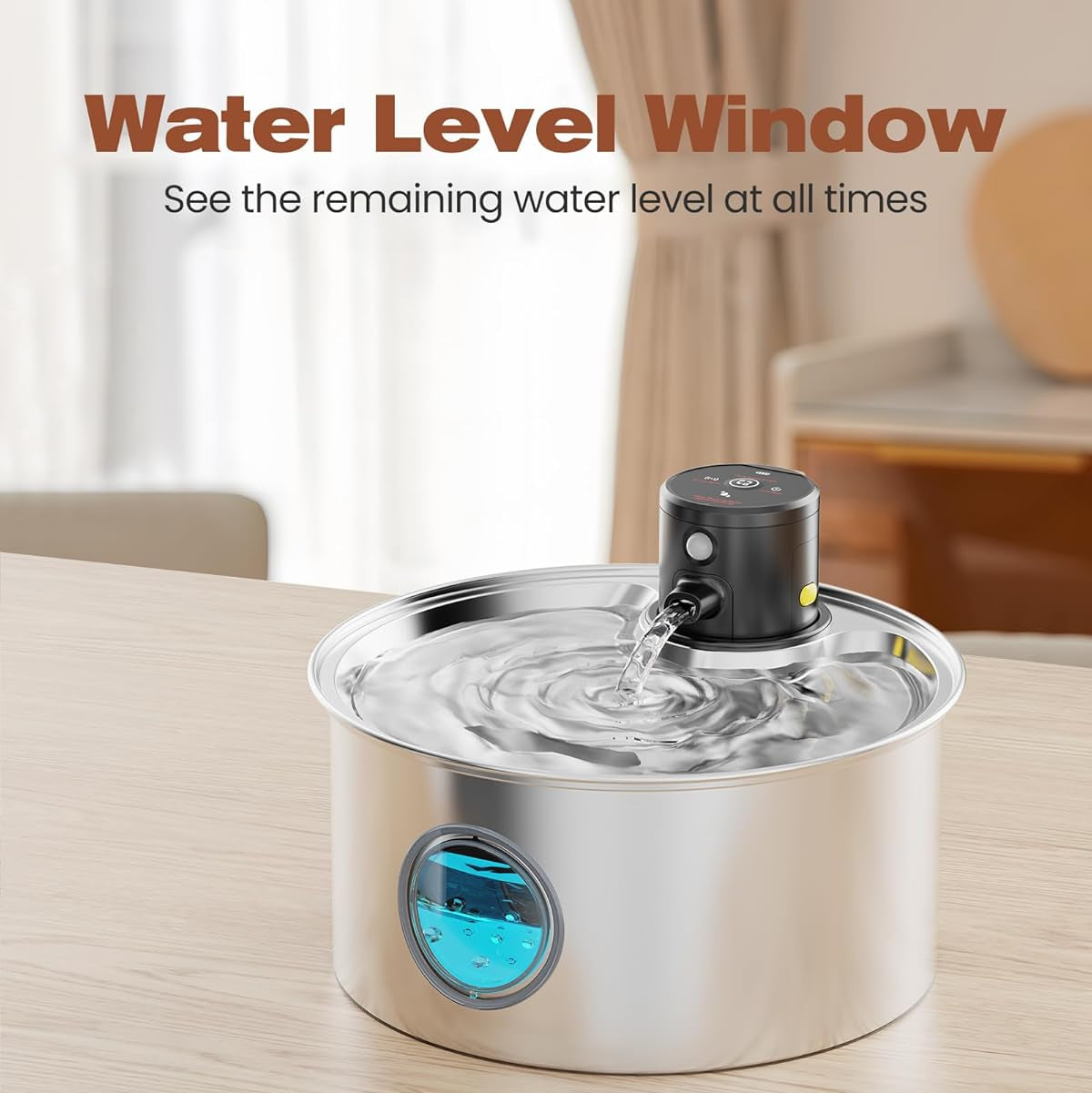 A stainless steel water fountain with a sensor, featuring a water level window and a small water dispenser on top, placed on a table.