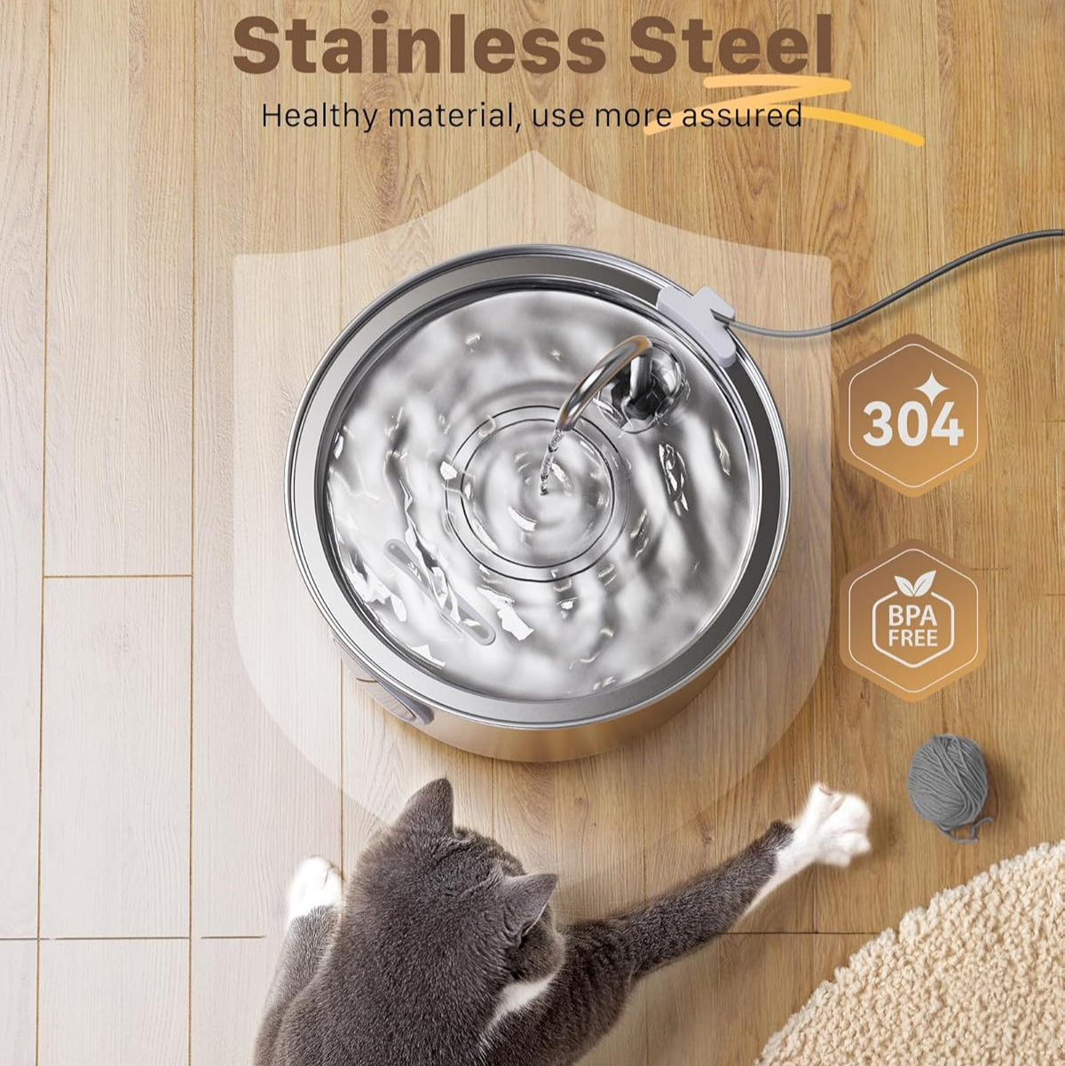 Stainless steel pet water fountain on a wooden floor with a cat drinking from it, featuring material and safety certifications.