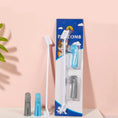 Load image into Gallery viewer, Packaged toothbrush set with a blue and white design on a pink background
