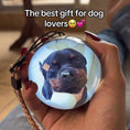 Load image into Gallery viewer, Hand holding a round pouch with a dog's face printed on it, labeled 'The best gift for dog lovers'.
